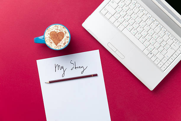 istock paper, coffee and laptop lying on the table 514000454