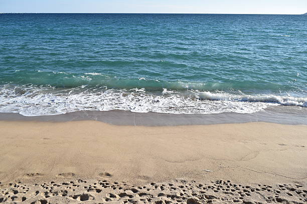 Footprints on Beach in Cannes, France stock photo