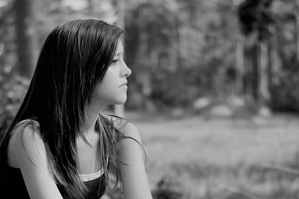 istock girl thinking in b&w 514001156