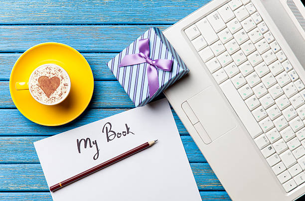 istock paper, gift, coffee and laptop lying on the table 514002546