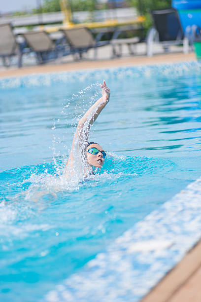istock Woman in goggles swimming front crawl style 514002764
