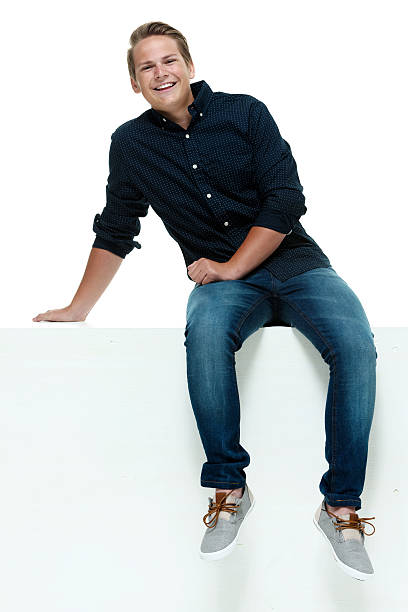 istock Smiling casual man on box & looking at camera 514026447
