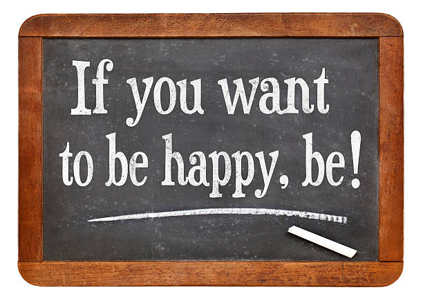 if you want to be happy, be if you want to be happy, be - a quote form Leo Tolstoy on a vintage slate blackboard leo tolstoy stock pictures, royalty-free photos & images