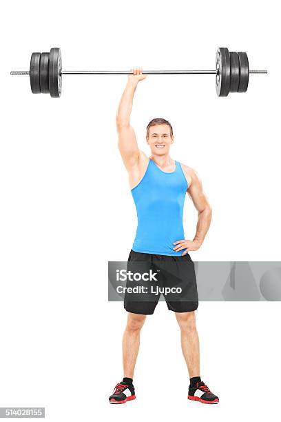 Strong Athlete Holding A Weight In One Hand Stock Photo - Download Image Now - 20-29 Years, Adult, Adults Only