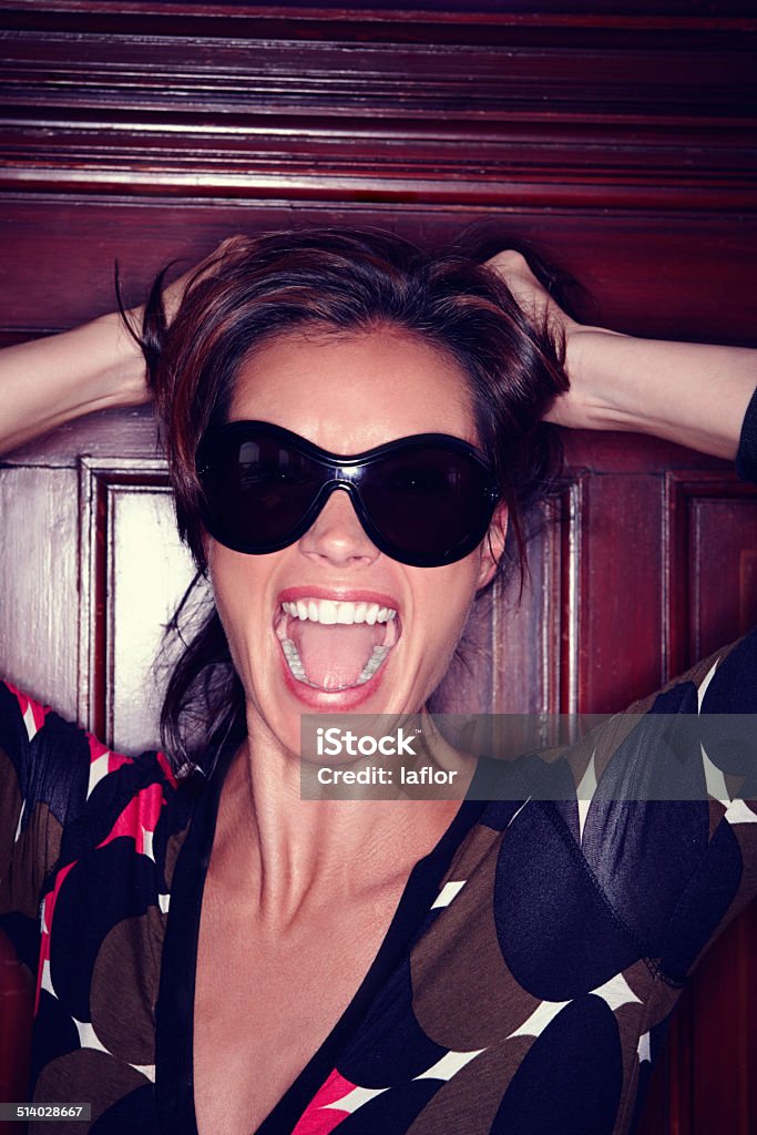 Fashion with attitude A beautiful young model posing with sunglasses 40-49 Years Stock Photo