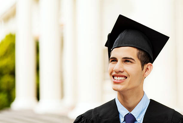 istock Student Wearing Mortar Board While Looking Away On Graduation Day 514029041