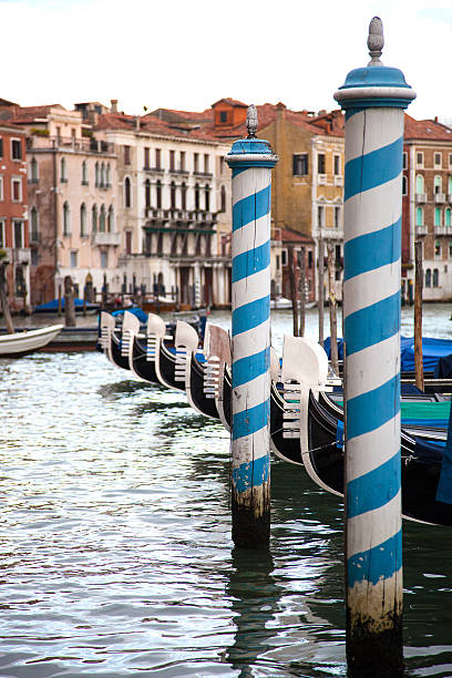 Gondolas in Venice Gondolas in Venice before sundown grand canal china stock pictures, royalty-free photos & images