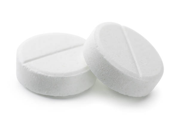 Two pills Pair of white pills isolated on white aspirin photos stock pictures, royalty-free photos & images
