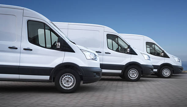 istock White vans in a row on parking lot 514033015