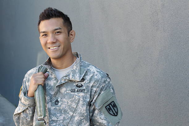 Happy healthy ethnic army soldier Happy healthy ethnic army soldier with copy space on the right uniform photos stock pictures, royalty-free photos & images