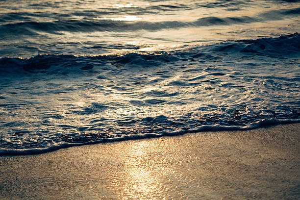 istock Abstract toned image of ocean wave and sand 514049194