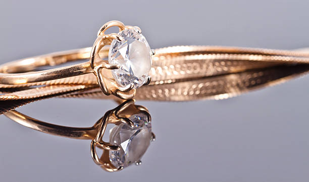 istock Thin delicate gold ring with diamond and gold chain 514049386