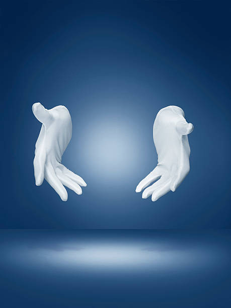 magicians hands demonstrating magic trick Magicians hands on blue background with clipping path formal glove stock pictures, royalty-free photos & images
