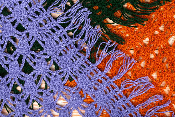 istock Knitted woolen female shawls on wooden background 514050878