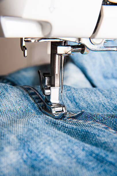 istock Close-up of sewing machine with blue cotton 514054702