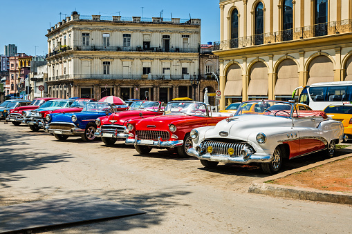 Vintage American car parked on street near Parque Central (Central Park), Havana, Cuba, Central America.