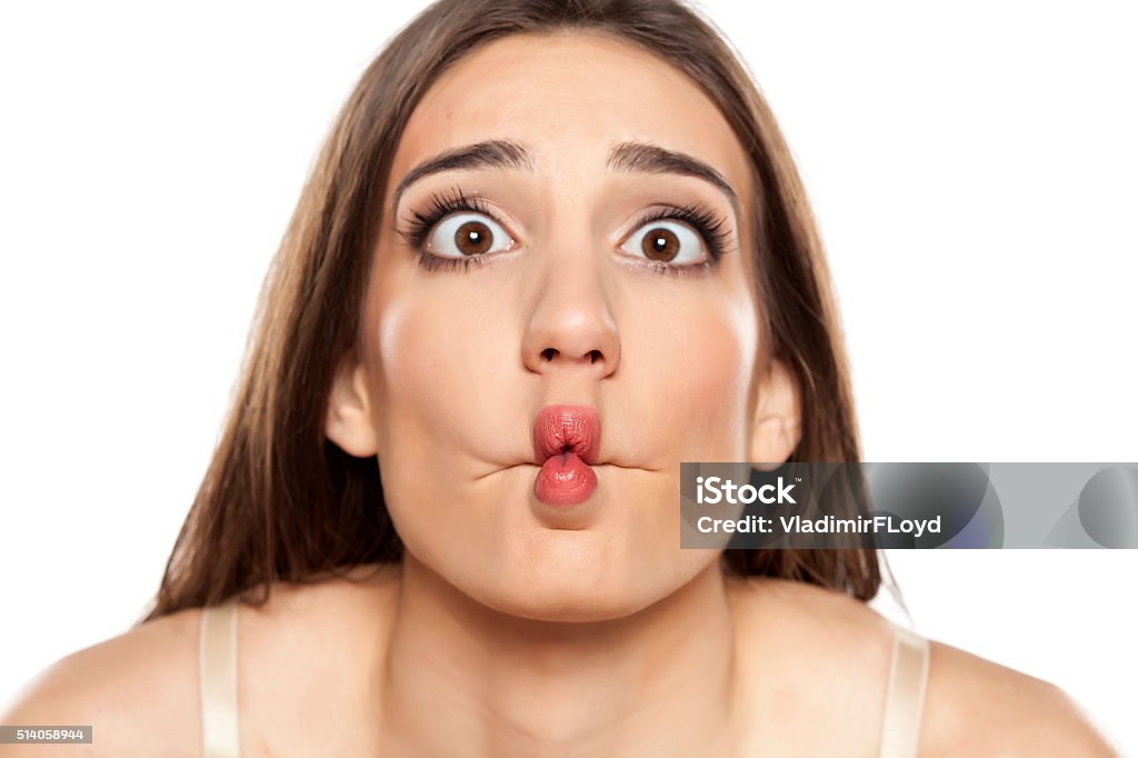 silly woman silly young woman making funny faces Fish Stock Photo