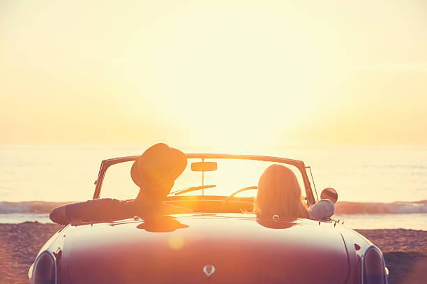 istock Couple watching the sunset in a convertible car. 514059046