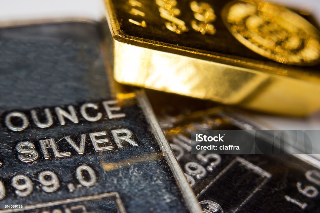 Precious metals Close-up of a gold-ingot on top of a troy ounce silver and palladium bar Silver - Metal Stock Photo