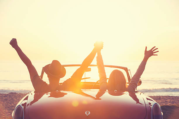 istock Couple watching the sunset in a convertible car. 514059174