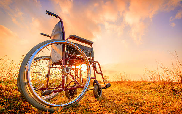 istock Empty wheelchair on the meadow at sunset 514060214