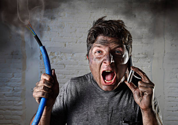 istock electrocuted man calling for help in dirty burnt funny face 514061798