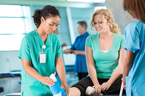 Physical therapist works with young athlete