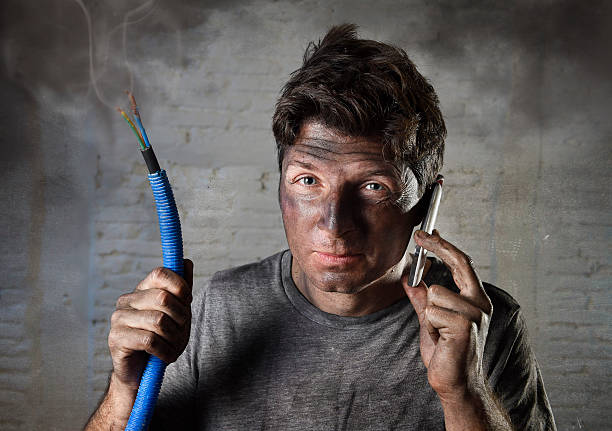 istock electrocuted man calling for help in dirty burnt funny face 514062160