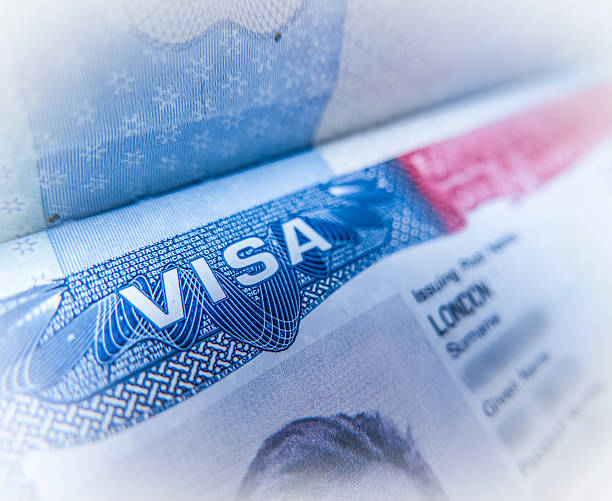 Detail Of A USA Visa Detail Of A United States Of America Work Visa In A UK Passport emigration and immigration stock pictures, royalty-free photos & images