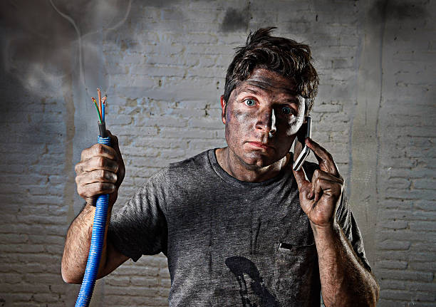 istock electrocuted man calling for help in dirty burnt funny face 514063006