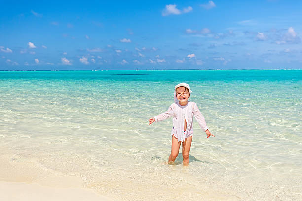 istock Little girl on the beach 514063250