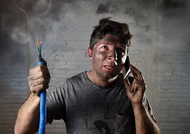 Photo of electrocuted man calling for help in dirty burnt funny face