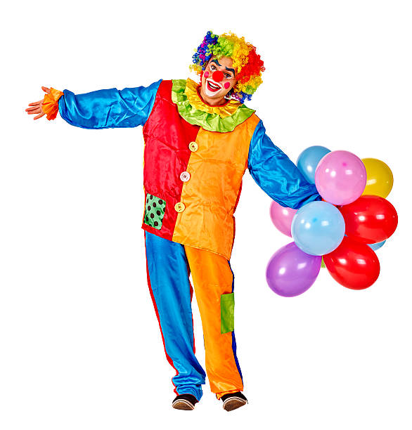 Happy birthday clown holding a bunch of balloons stock photo