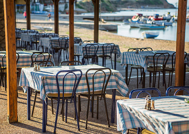 istock Greek tavern with blue chairs, Greece 514065582