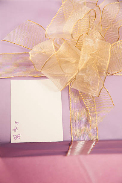 istock Purple wrapped birthday gift with blank card. 514067100