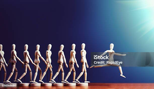 Brave Puppet Breaks Away From Pack Leaping Into Spotlight Stock Photo - Download Image Now