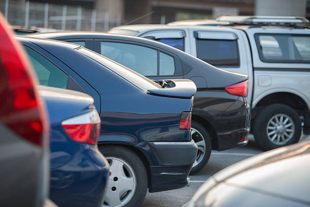 istock cars in a row on a parking lot 514069800