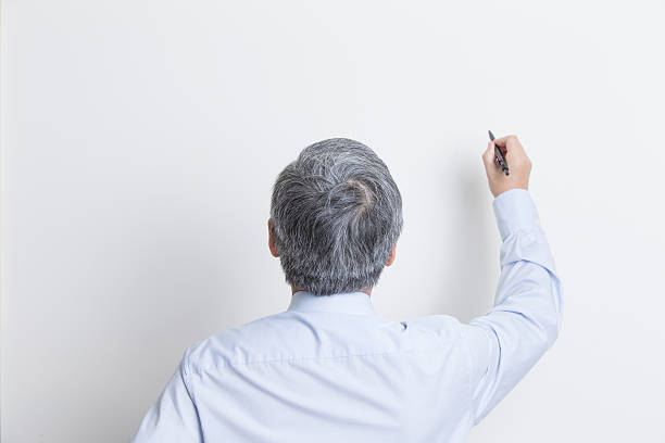 istock The senior business man write 514070474