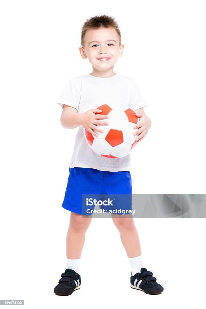 Cheerful nice boy Cheerful nice boy posing with a soccer ball. Isolated on white Activity Stock Photo