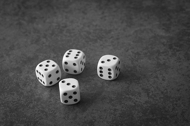 istock group of 4 white dice on grey background 514074011