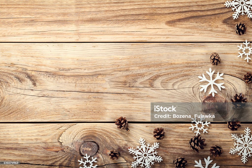 Christmas Background Christmas background with snowflakes and cones on wooden table with copy space. Top view Christmas Stock Photo