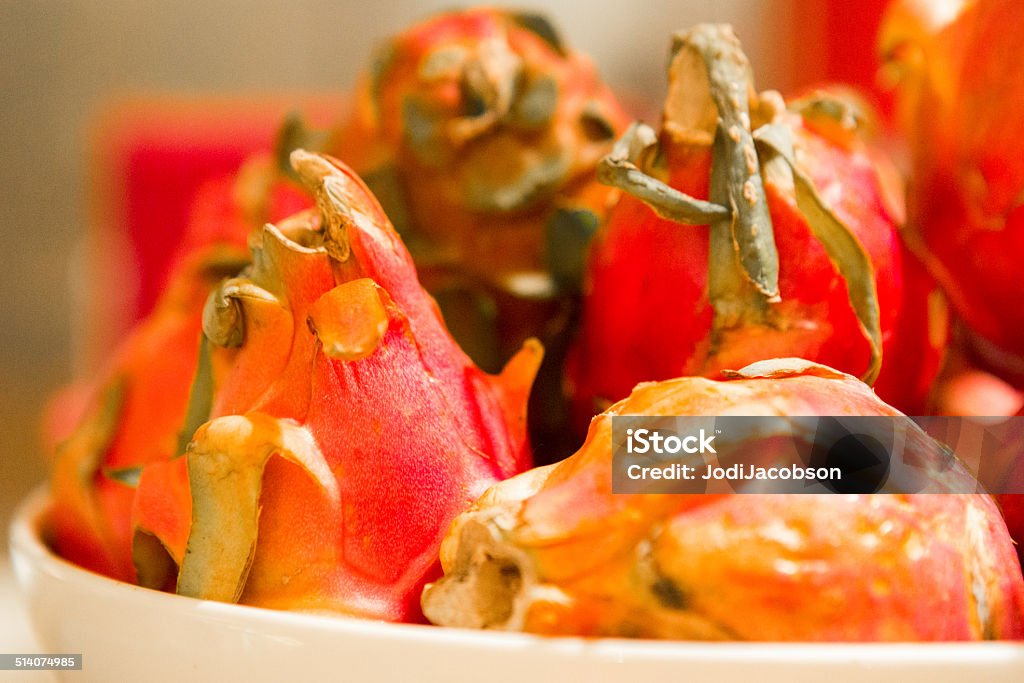 Bowl of Pitahaya Dragon fruit (Hylocereus) Bowl containing bright orange Pitahaya Dragon fruit.  rr Bowl Stock Photo