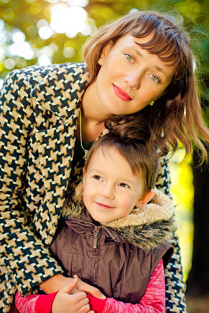 istock Family in autumn park 514075165