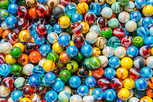 Pile of different marbles from above