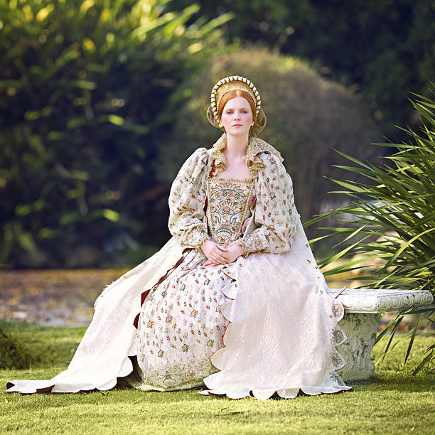 Awaiting her king Portrait of a noble woman sitting outdoors on palace grounds renaissance dress stock pictures, royalty-free photos & images