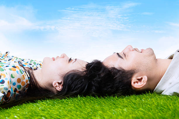 istock Happy couple with heads together on field 514078819