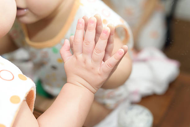 istock Baby looking at herself in mirror 514079349