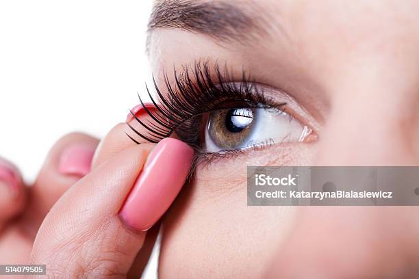 Woman Applying False Eyelashes Stock Photo - Download Image Now - Adult, Applying, Artificial