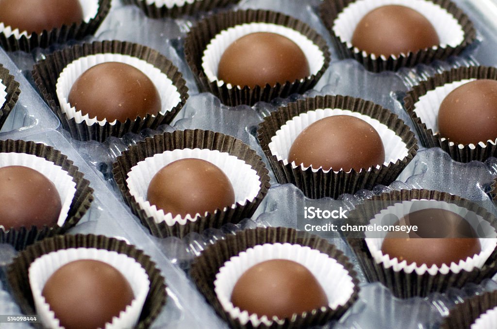 Chocolate balls Mix of dipped Chocolate balls on display. Brown Stock Photo