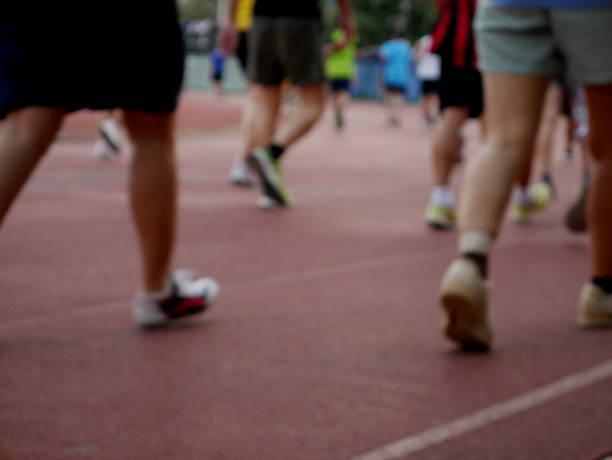 istock Asians jogging/walking in running track 514100174